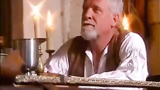 A woman with big natural tits is getting fucked in medieval style