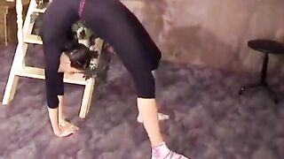 A beautiful gymnast has excellent flexibility and is very proud of it, showcasing it in steamy scenes