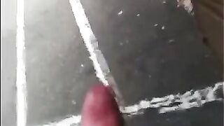 The guy just does not care and jerks off his cock on the street