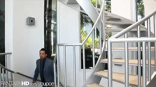 A masseuse has two male clients at her home and she gives them a massage
