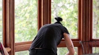 Vietnamese with a strap-on fucks a young girl in the kitchen, a steamy scene straight out of StrapOn’s adventurous content