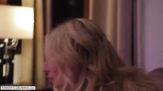A busty blonde porn star Kayley Gunner gives a foot job while wearing sexy stockings