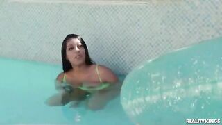 The girl received swimming lessons from a handsome guy in the pool