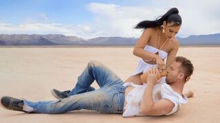 A woman is making a sexy video with a mask on