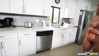 A mature woman is completely naked while cleaning the house
