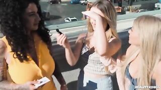 Two girls are having fun on the strip with each other
