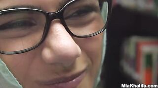 The sexy Mia Khalifa reads a book and masturbates in the library