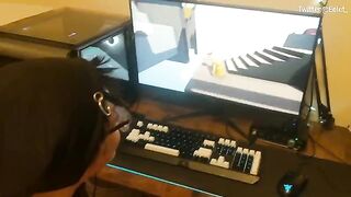A cute girl lost in a video game, her boyfriend helped her