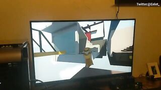A cute girl lost in a video game, her boyfriend helped her