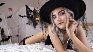 A cute witch in a sexy outfit waiting for the magic of sex