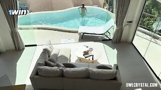 A beautiful girl enjoys a solo moment by the pool