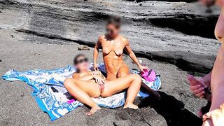 A girl removed her swimwear and caressed herself on the beach