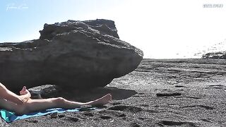 A girl removed her swimwear and caressed herself on the beach