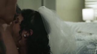 A brunette with a tattoo slowly and painfully licks her pussy on the bed